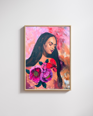 Framed artwork of a woman with long hair and flowers on a light gray background