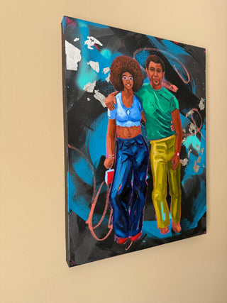 Side view of colorful artwork of two people embracing hanging on the wall